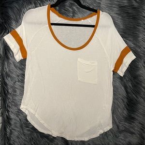 Me to We t shirt cream with mustard accents pocket